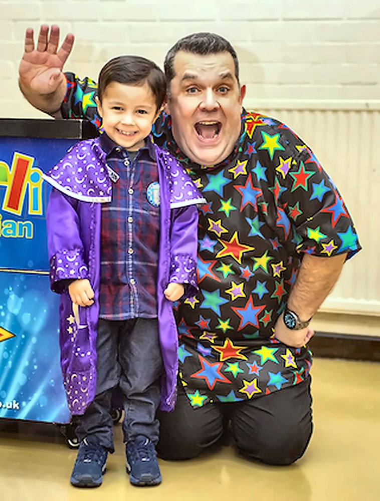 Marli the Magician sharing a smile with a happy child, children's magician in Kent
